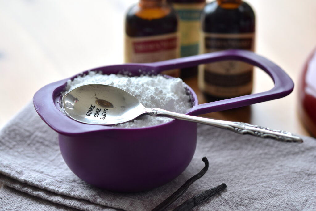 Icing sugar cup with cute spoon on top